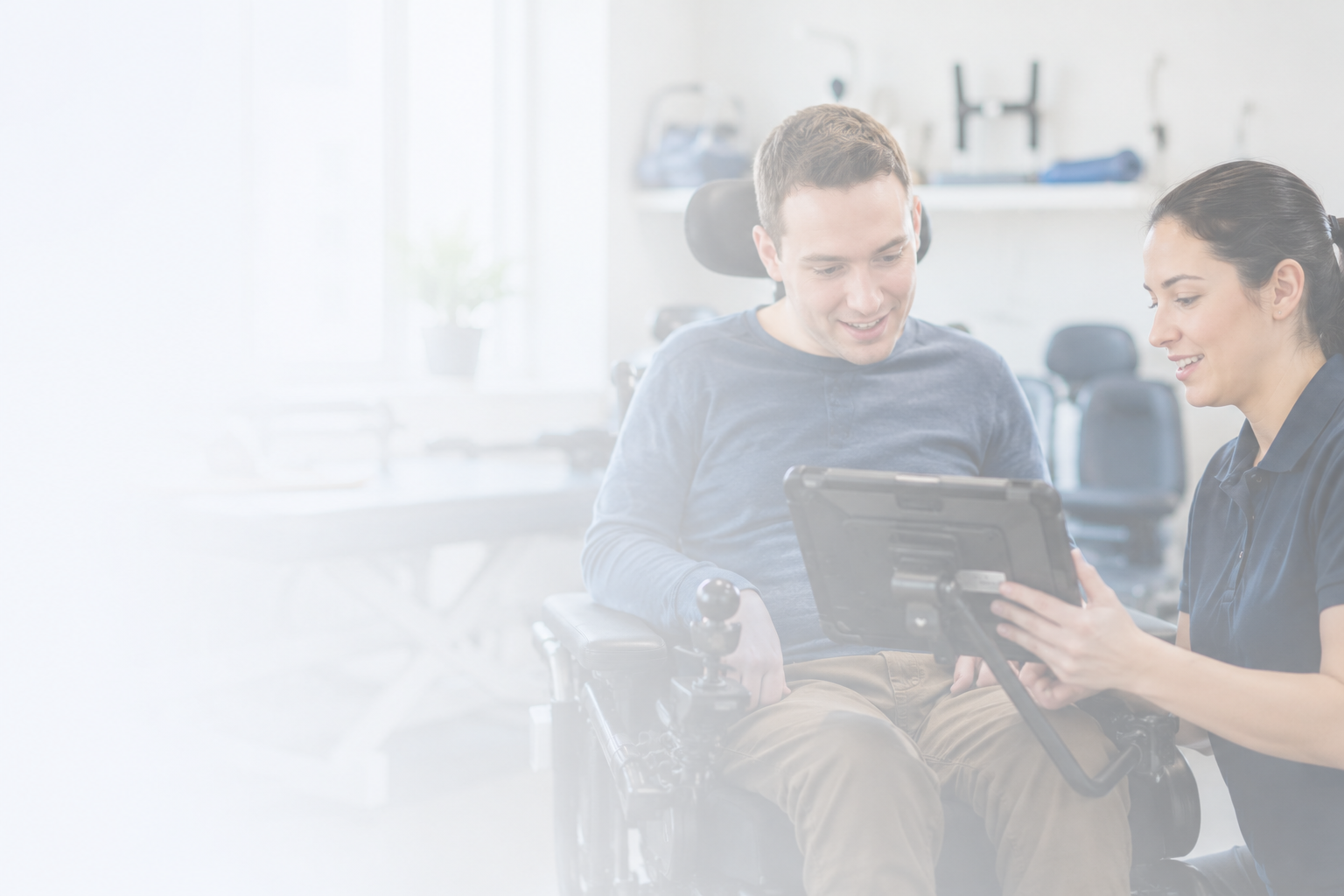 A Caremax team member helping a client with his wheelchair